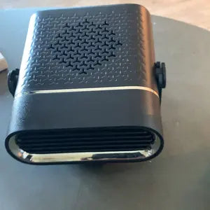 Portable car heater on dashboard